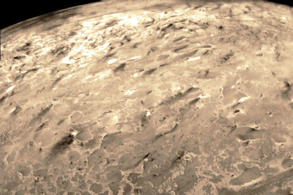 Dark streaks across Triton's south polar cap surface